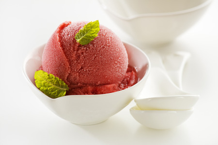 Fresh fruit ice cream or sorbet in a cup close up.の写真素材