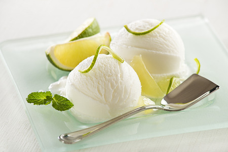 Fresh lemon and lime ice cream served on a plate.の写真素材