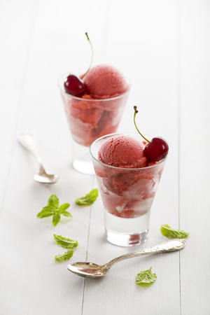Fresh cherry ice cream or sorbet in glass.の写真素材