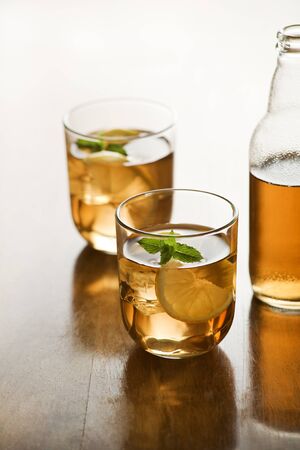Glass of ice tea with lemon and ice cubes.の写真素材