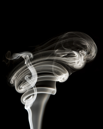 Smooth realistic smoke flowing wave on dark background.の写真素材
