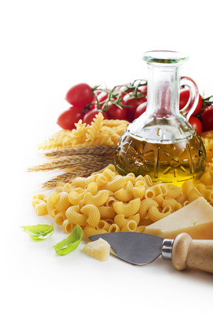 Raw Pasta with ingredients on white background.の写真素材