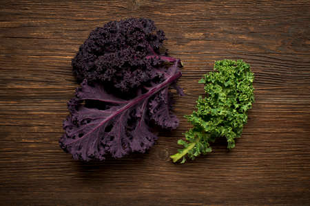 Fresh kale leaf on wooden background close upの写真素材