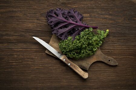 Fresh kale leaf on wooden background close upの写真素材