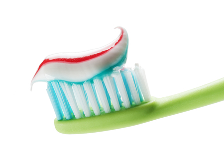 Toothbrush and toothpaste isolated on white close up.の写真素材
