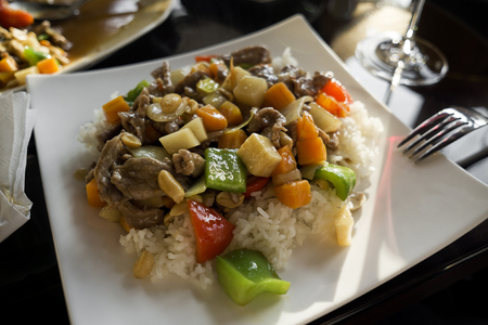 Chinese food - stir fry beef with vegetables and nuts.の写真素材