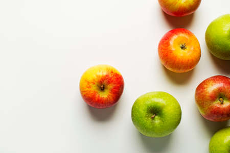 Red and green apples on white background.の写真素材