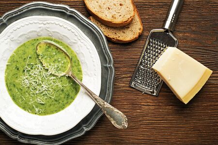 Fresh green soup on wooden background overhead shoot.の写真素材