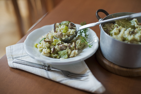 Risotto with mushrooms, meat and fresh herbs.の写真素材