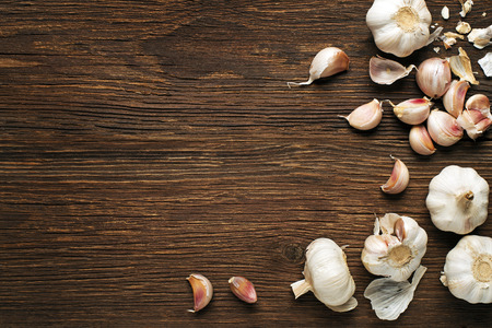 Garlic cloves on a vintage wooden background.の写真素材