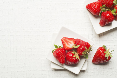 Fresh red Strawberries fruit on a white background.の写真素材