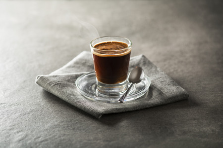 Cup of espresso coffee on dark background.の写真素材