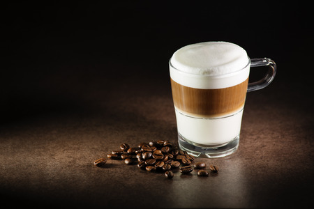 Glass of hot Latte macchiato coffee close upの写真素材
