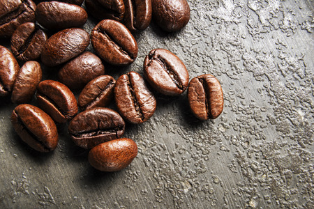 Coffee beans on gray background on close upの写真素材