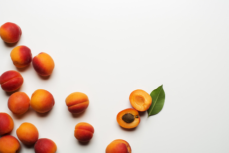 Fresh cut apricot fruits on white backgroundの写真素材