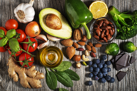 Selection of healthy food on wooden background. Healthy diet foods for heart cholesterol and diabetes.の写真素材