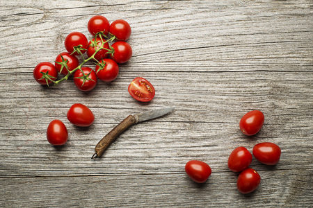 Fresh tomatoes on wooden background. Top viewの写真素材