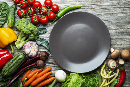 Various fresh vegetables and ingredients on wooden rustic backgroundの写真素材
