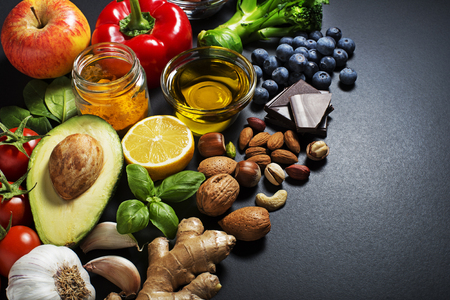 Mixed of fresh healthy food on dark backgroundの写真素材