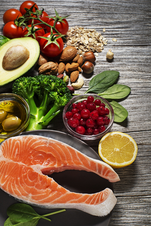 Mixed fresh healthy food with salmon fish- heart conceptの写真素材
