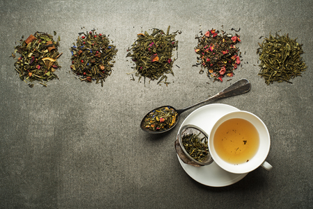 Cup of tea with dry tea collection of different typesの写真素材