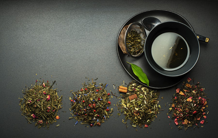Cup of tea with dry tea collection of different typesの写真素材