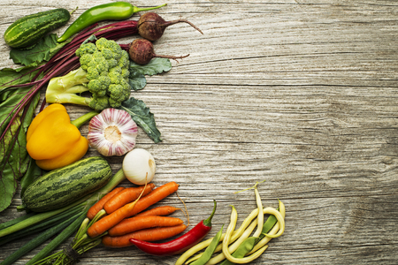 Various of fresh vegetables and ingredients on wooden rustic backgroundの写真素材