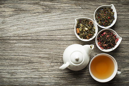 Cup of tea with dry tea collection of different typesの写真素材