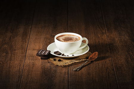 Cup of hot chocolate and cappuccino on wooden background.の写真素材