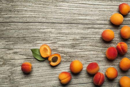 Delicious ripe apricots fruit on wooden background close upの写真素材