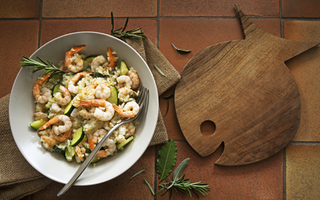 Risotto with shrimp. On a wooden background. Top view. Free space for your text.の写真素材