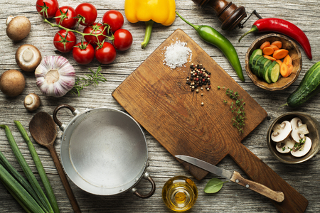 Fresh ingredients for cooking meal on wooden background place for text. Vegan food vegetarian and healthy cooking concept.の写真素材