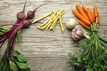 Assortment of fresh vegetables and ingredients on wooden rustic backgroundの写真素材
