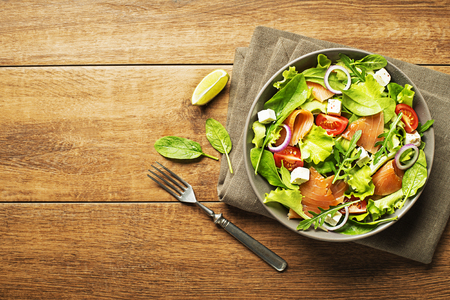 Fresh green salad with smoked salmon and cheeseの写真素材