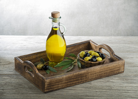 Bottle of Extra virgin healthy Olive oil with fresh olives. Concept of nature and healthy foodの写真素材