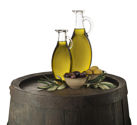 Bottles of Extra virgin healthy Olive oil with barrel backgroundの写真素材