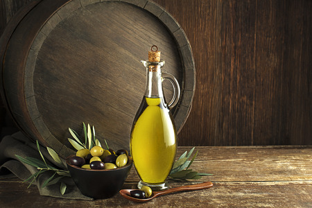 Bottle of Extra virgin healthy Olive oil with barrelの写真素材