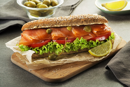 Sandwich with smoked salmon salad and tomato. Healthy food.の写真素材