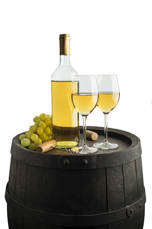 Bottle of white wine on old barrel isolated on white. Wine bottle background.の写真素材