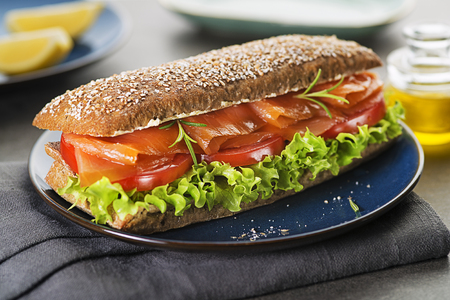 Sandwich with smoked salmon salad and tomato. Healthy food.の写真素材