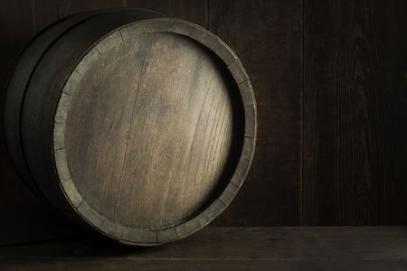 Brewery, winery background. Wine, beer barrels stacked background. Wooden barrel backgroundの写真素材
