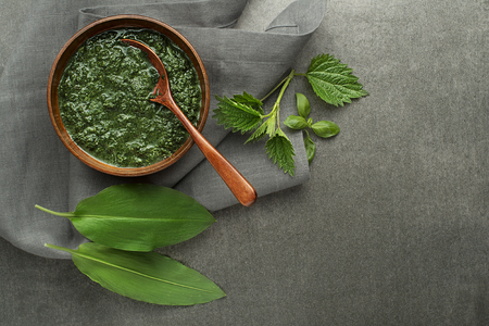 Spring healthy food. Nettle and wild garlic soup on gray backgroundの写真素材