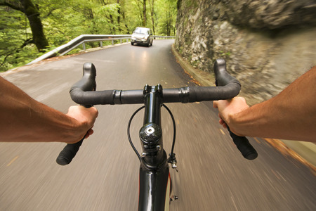 Road cycling wide angle speed shoot in nature. Landscape cycling in roadの写真素材