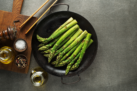 Fresh of green Asparagus. Cooking healthy meal in pan. Bunches of green asparagus, top view- Imageの写真素材