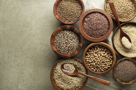 Various of healthy seeds and cereals - sesame, flax seed, chia seeds, soybean, buckwheat and oats. Copy space.の写真素材