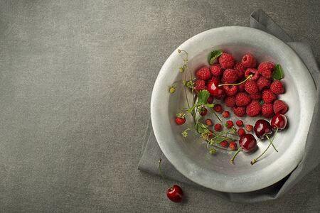 Berries with green leaf close up. Healthy food with fresh berry fruit.