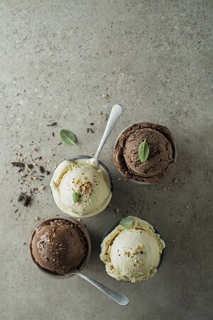 Set of ice cream scoops with chocolate and vanilla flavoursの写真素材