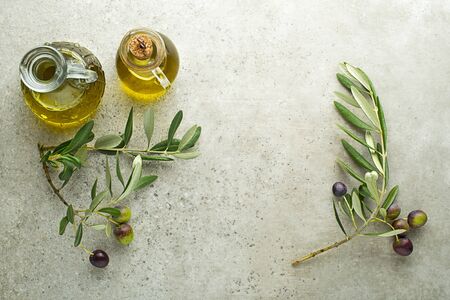 Healthy olive oil bottle with fresh olives ingredients close up. Healthy conceptの写真素材
