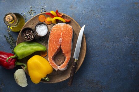 Cooking healthy meal with salmon steak  and vegetablesの写真素材