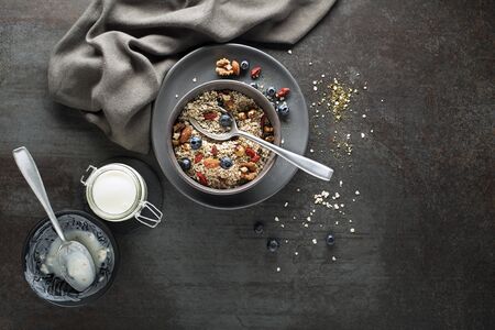 Breakfast served with oatmeal, yogurt and fruits.の写真素材